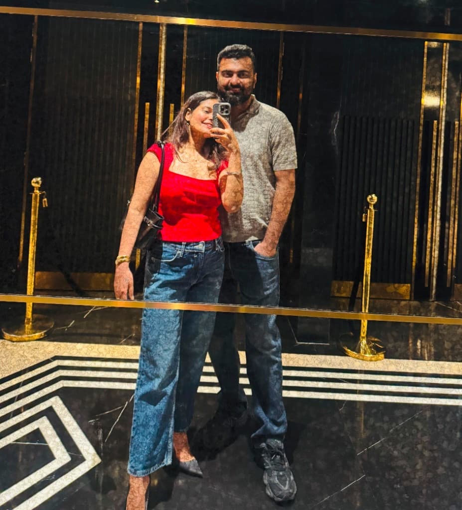 Charu and Alok in a mirror selfie before a night out